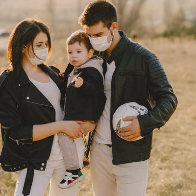 stylish-family-walking-sunny-field
