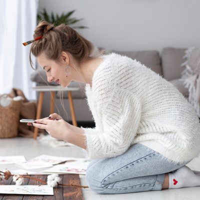 side-view-woman-making-vlog-her-paintings-home