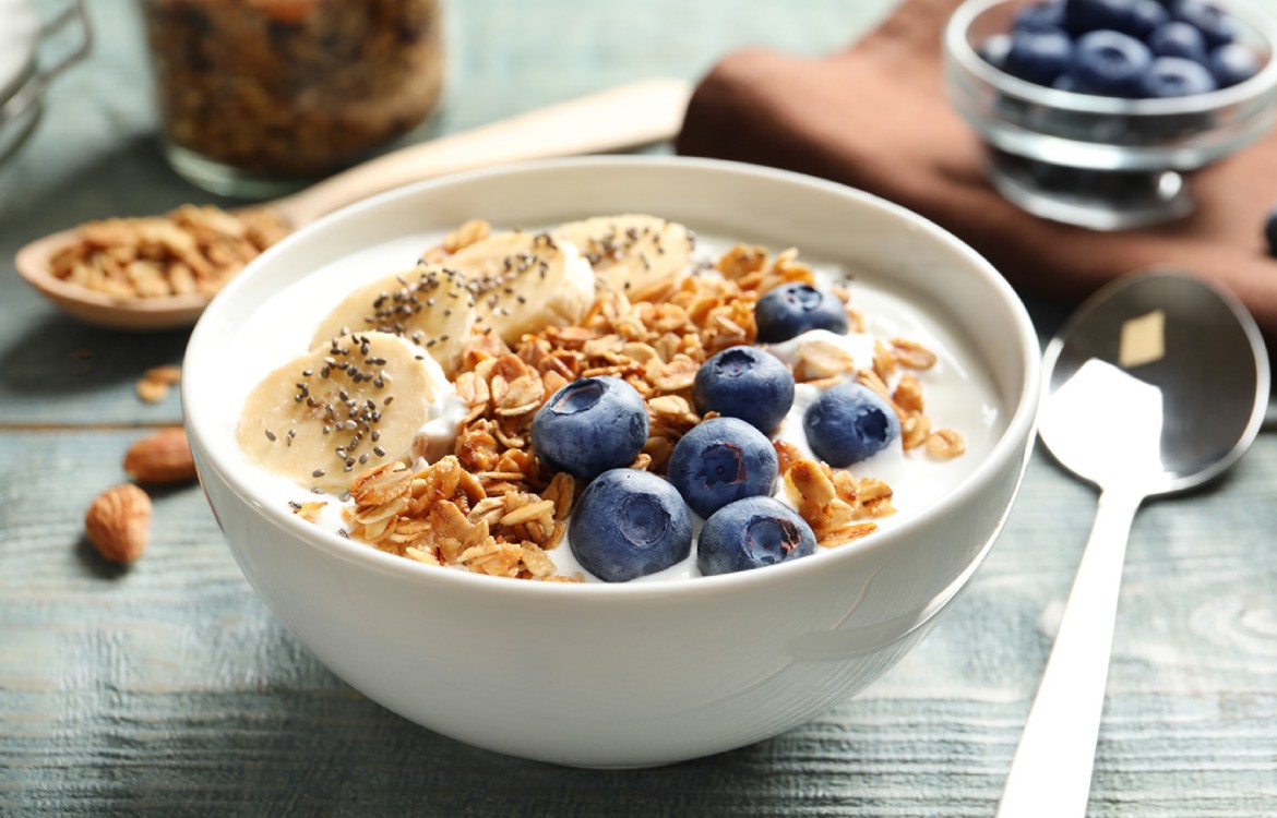 Fresh plums and pecan in Greek yoghurt
